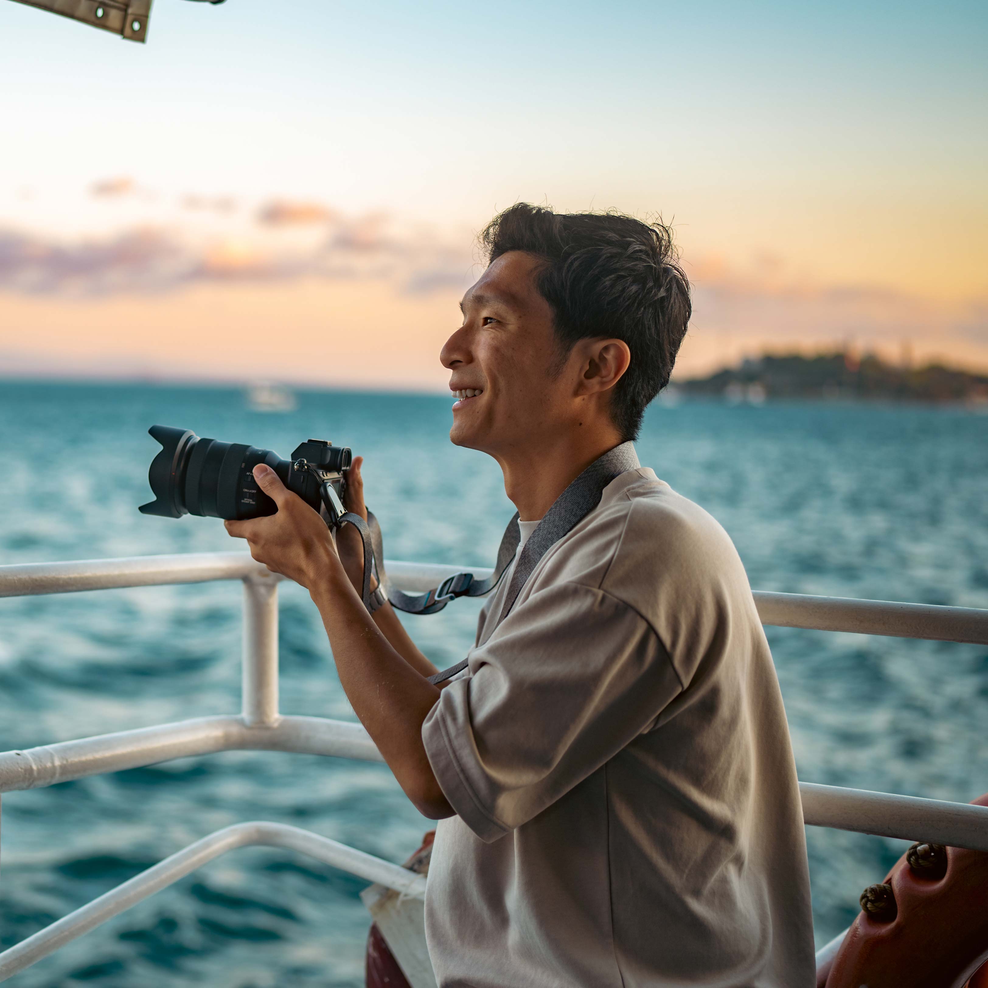Man clicking images on a boat with a camera